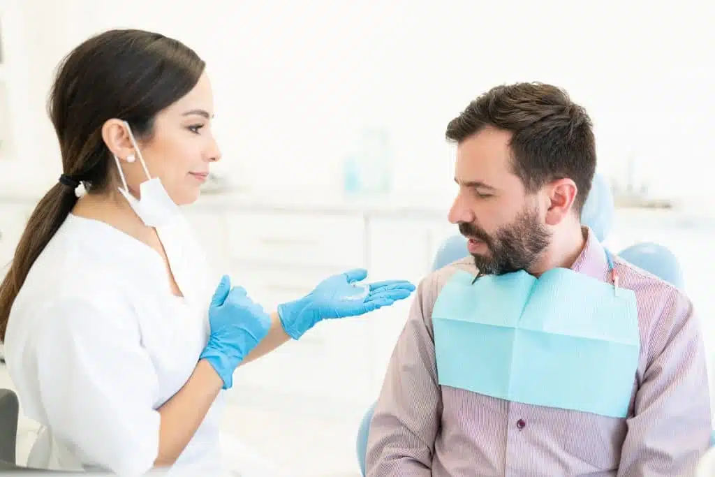 Man at the dentist gets his aligners