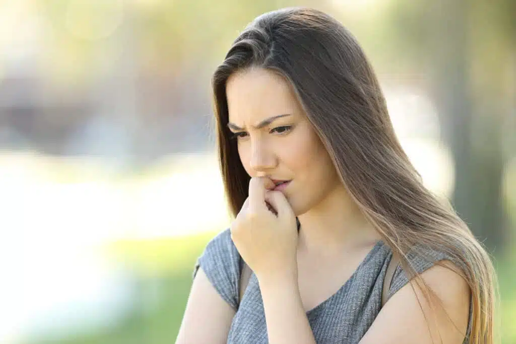 Overbite: What is it actually and how does the treatment proceed? 2 Young woman pensive - overbite