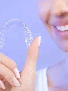 Young Woman uses Aligner - Average Cost of Braces per Month